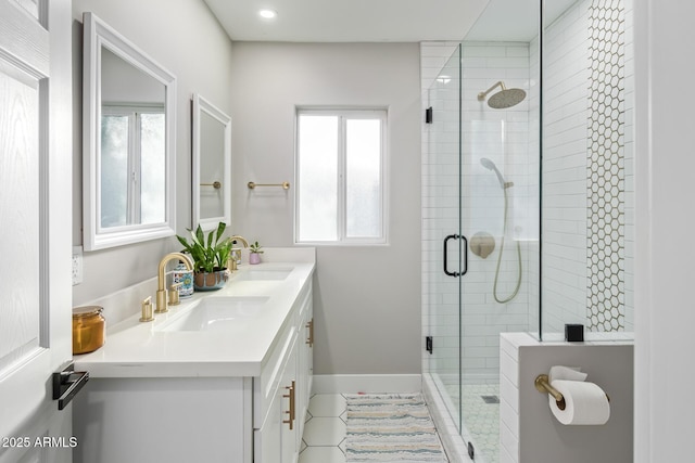 1702 W Glenrosa Ave, Phoenix, AZ 85015 - full bath with tile patterned flooring, a stall shower, double vanity, baseboards, and recessed lighting