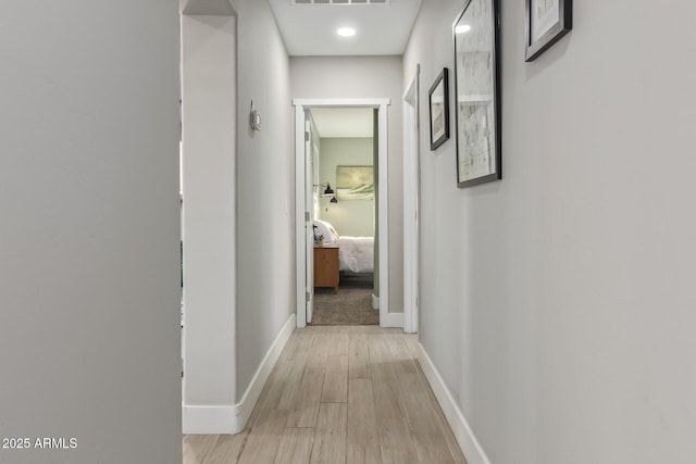 1702 W Glenrosa Ave, Phoenix, AZ 85015 - hallway with light wood-style floors and baseboards