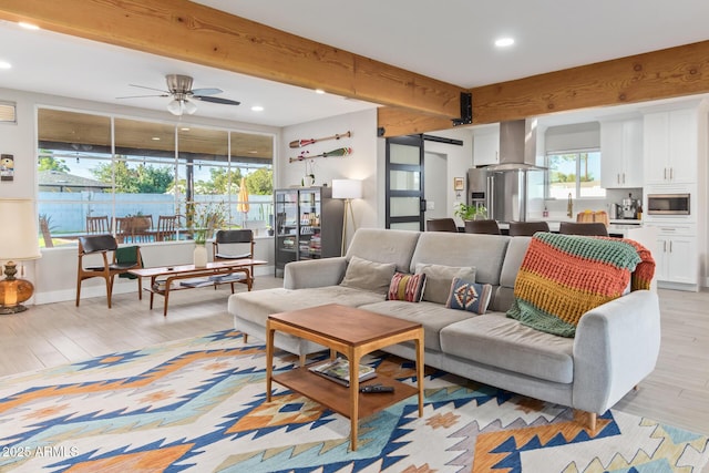 1702 W Glenrosa Ave, Phoenix, AZ 85015 - living area featuring light wood-style flooring, a ceiling fan, recessed lighting, beam ceiling, and a barn door