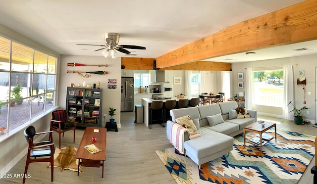 1702 W Glenrosa Ave, Phoenix, AZ 85015 - living area featuring light wood-type flooring, baseboards, and ceiling fan