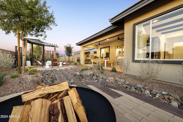 exterior space featuring ceiling fan