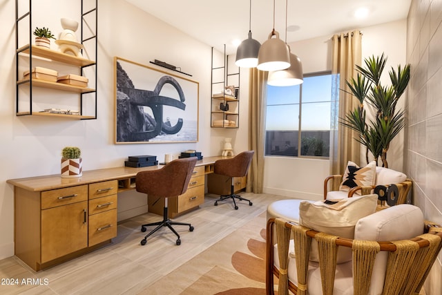 office area with tile walls and built in desk