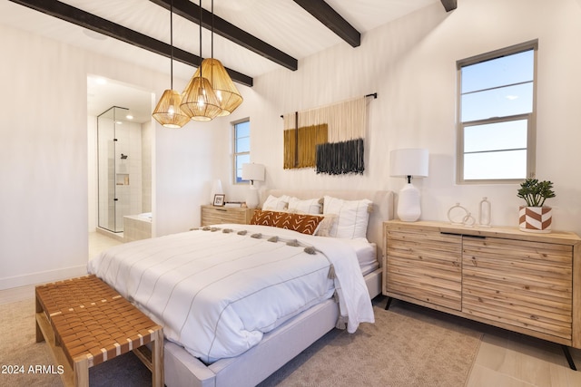 bedroom with multiple windows, connected bathroom, and beam ceiling