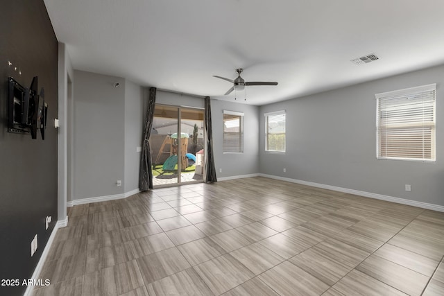 unfurnished room with ceiling fan