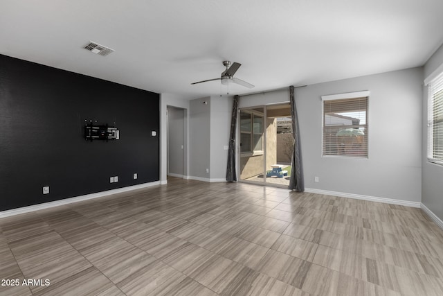 empty room featuring ceiling fan