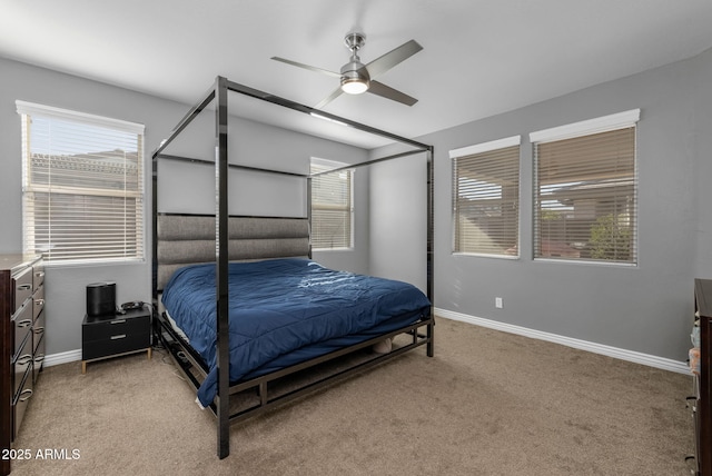 bedroom featuring ceiling fan and light carpet