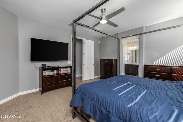 carpeted bedroom featuring connected bathroom and ceiling fan