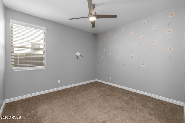 empty room with ceiling fan and carpet floors