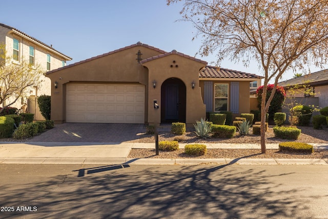 mediterranean / spanish-style home featuring a garage