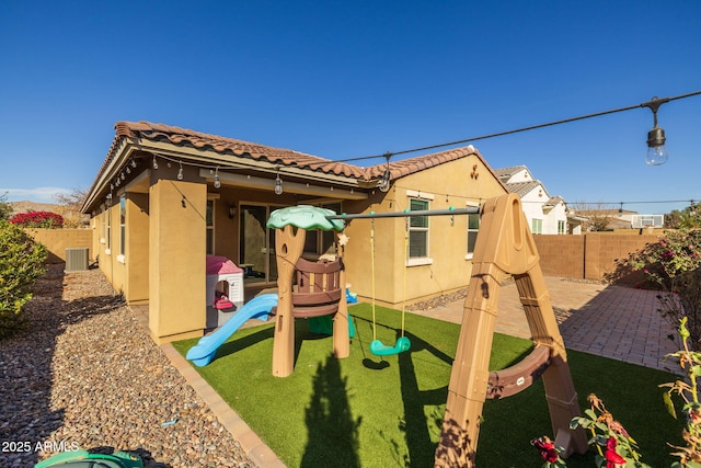 view of playground featuring a patio area and central AC