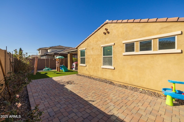 back of property with a patio area