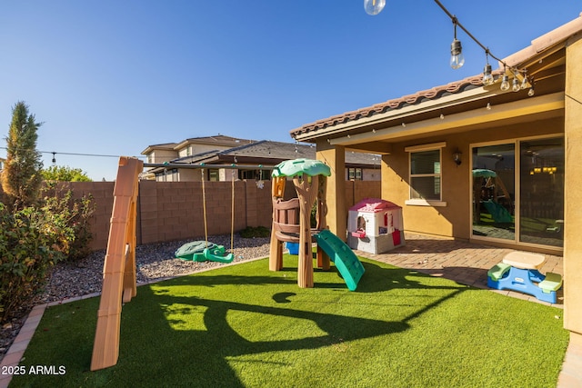 view of play area featuring a lawn