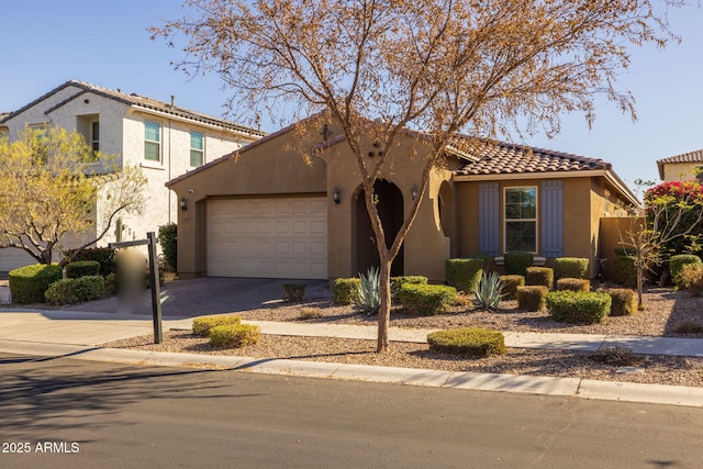 mediterranean / spanish-style home featuring a garage