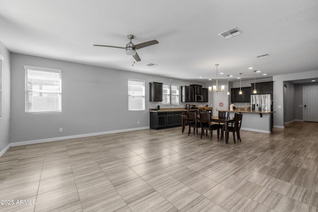 dining space with ceiling fan and a healthy amount of sunlight