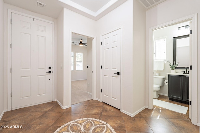 entrance foyer featuring visible vents and baseboards