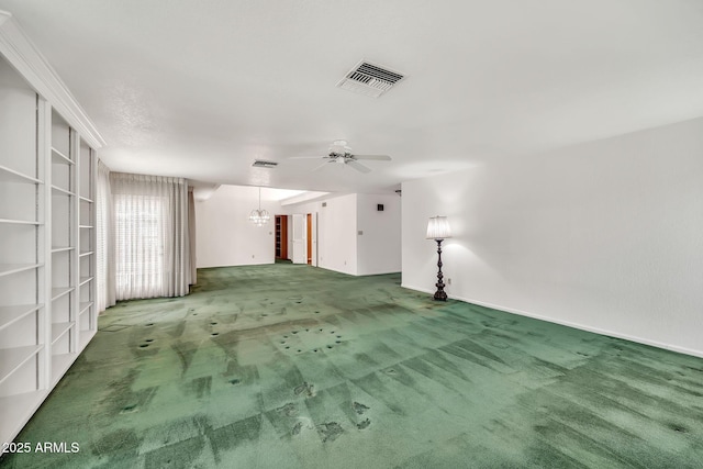 7037 N 11th Dr, Phoenix, AZ 85021 - carpeted spare room with a ceiling fan, a chandelier, and baseboards