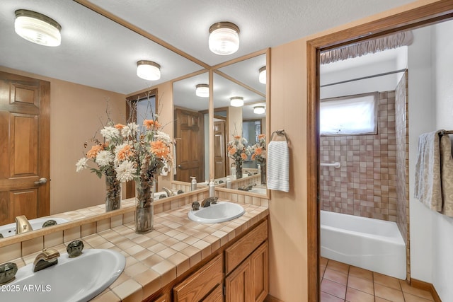 7037 N 11th Dr, Phoenix, AZ 85021 - full bathroom with double vanity, tile patterned flooring, tub / shower combination, and baseboards