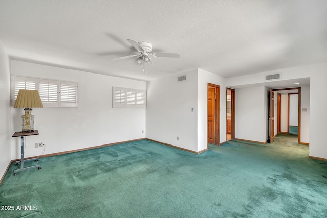 7037 N 11th Dr, Phoenix, AZ 85021 - unfurnished room featuring baseboards, ceiling fan, carpet, and a textured ceiling