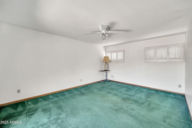 7037 N 11th Dr, Phoenix, AZ 85021 - carpeted spare room featuring baseboards, a ceiling fan, and a textured ceiling