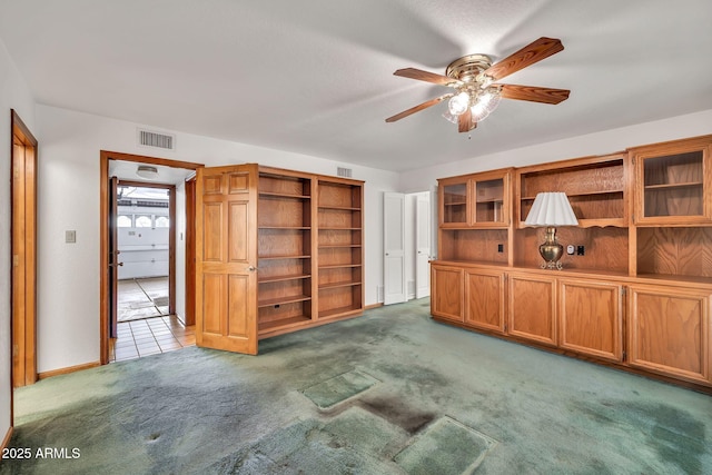 7037 N 11th Dr, Phoenix, AZ 85021 - unfurnished living room featuring carpet, a ceiling fan, and baseboards