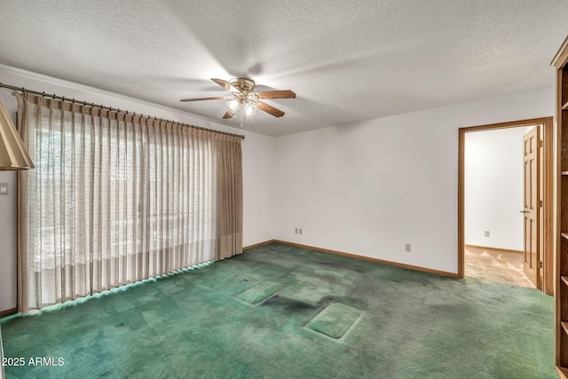7037 N 11th Dr, Phoenix, AZ 85021 - carpeted spare room with ceiling fan, baseboards, and a textured ceiling
