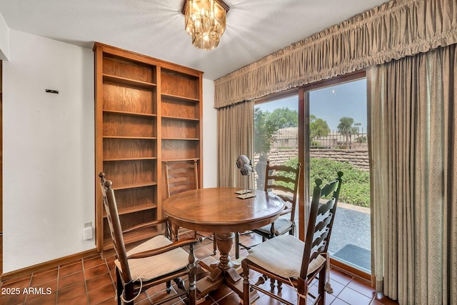 7037 N 11th Dr, Phoenix, AZ 85021 - tiled dining area with baseboards