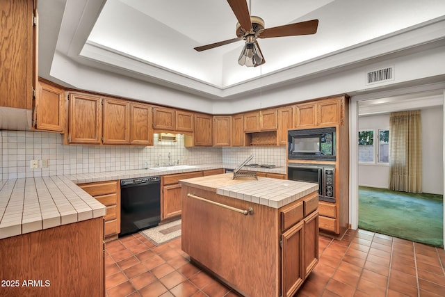 7037 N 11th Dr, Phoenix, AZ 85021 - kitchen with black appliances, tile countertops, a sink, and dark tile patterned flooring