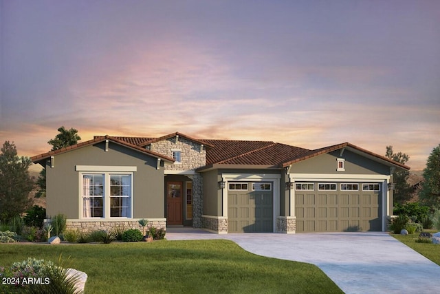 view of front of property with a garage, stone siding, concrete driveway, stucco siding, and a front lawn