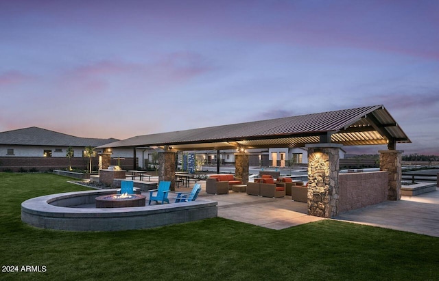 exterior space with a gazebo, a yard, and an outdoor fire pit