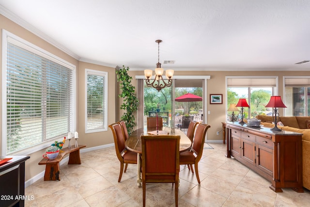 tiled dining room with ornamental molding and a chandelier