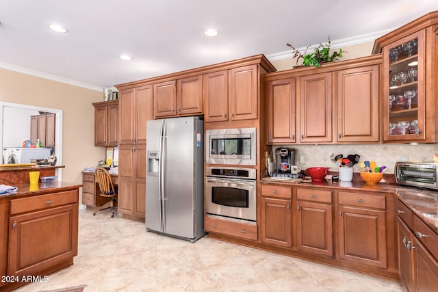 kitchen with ornamental molding, appliances with stainless steel finishes, decorative backsplash, and dark stone countertops