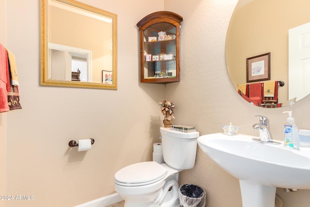 bathroom with sink and toilet