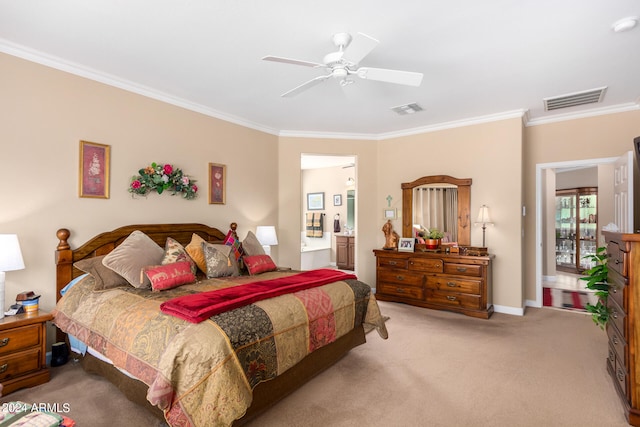 bedroom featuring ornamental molding, light colored carpet, ceiling fan, and ensuite bath