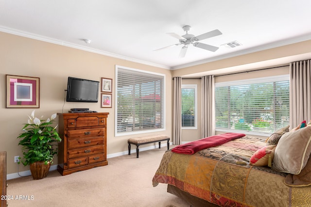 bedroom with crown molding, light carpet, and ceiling fan