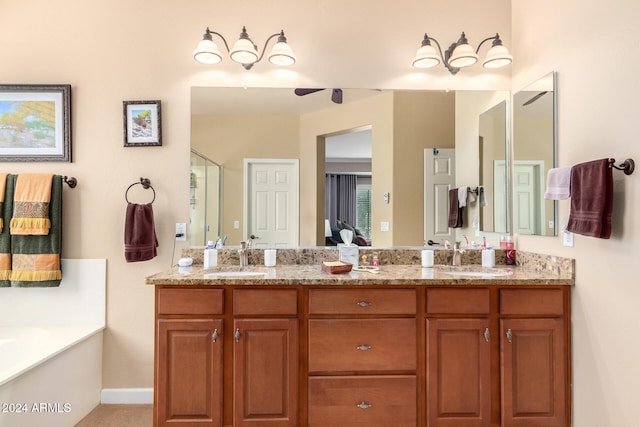 bathroom with vanity and separate shower and tub