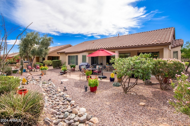 rear view of property with a patio