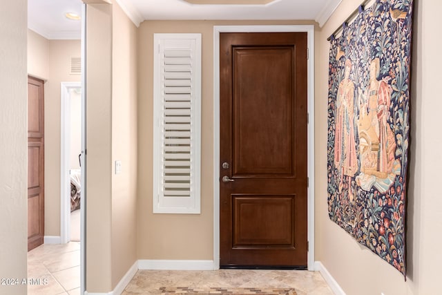 entryway featuring ornamental molding