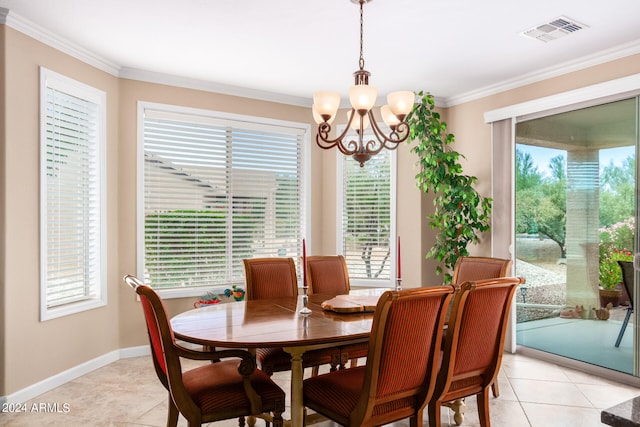 dining area with light tile patterned floors, crown molding, and a chandelier