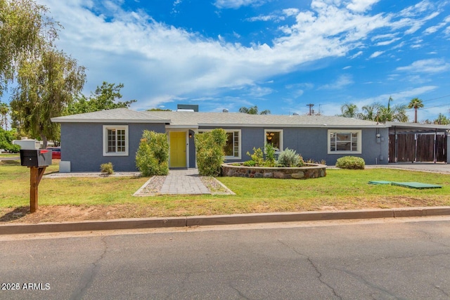 single story home with a front yard and stucco siding