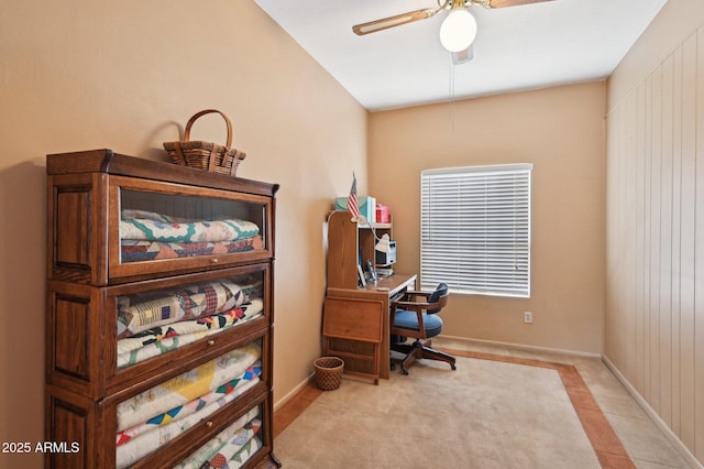 office featuring baseboards and ceiling fan