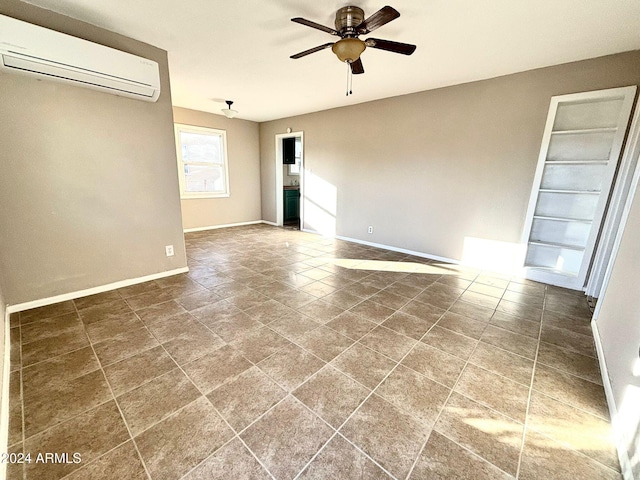 spare room with tile patterned flooring, ceiling fan, and a wall unit AC