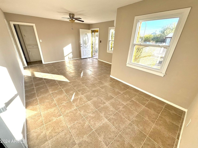 interior space featuring ceiling fan