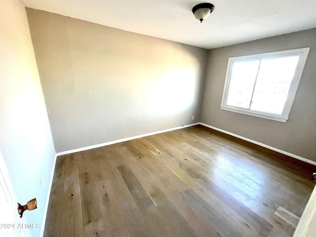 empty room featuring hardwood / wood-style floors