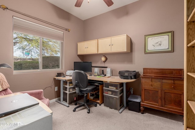 carpeted office featuring ceiling fan