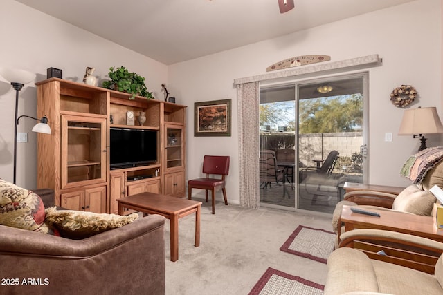 carpeted living room featuring ceiling fan