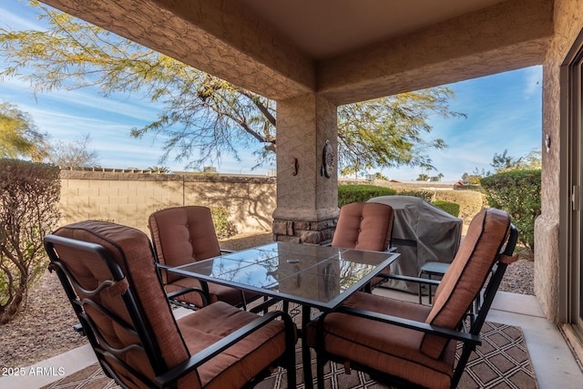 view of patio featuring a grill