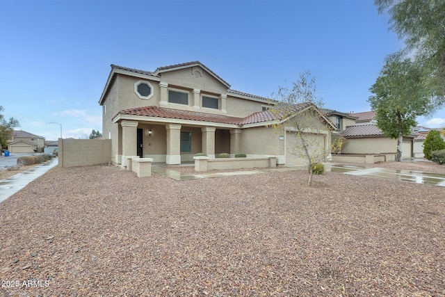 view of front of house with a porch, an attached garage, stucco siding, concrete driveway, and a tiled roof