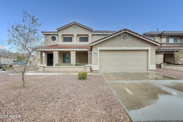 view of front of property featuring driveway, covered porch, stucco siding, a garage, and a tiled roof