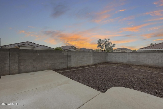 view of yard featuring a patio area and a fenced backyard