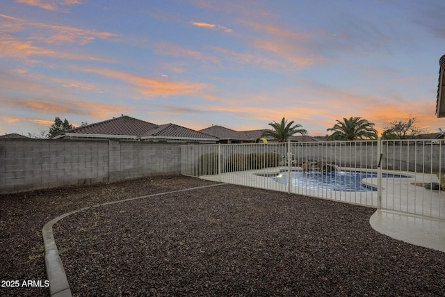 view of yard featuring a patio, a fenced backyard, and a fenced in pool